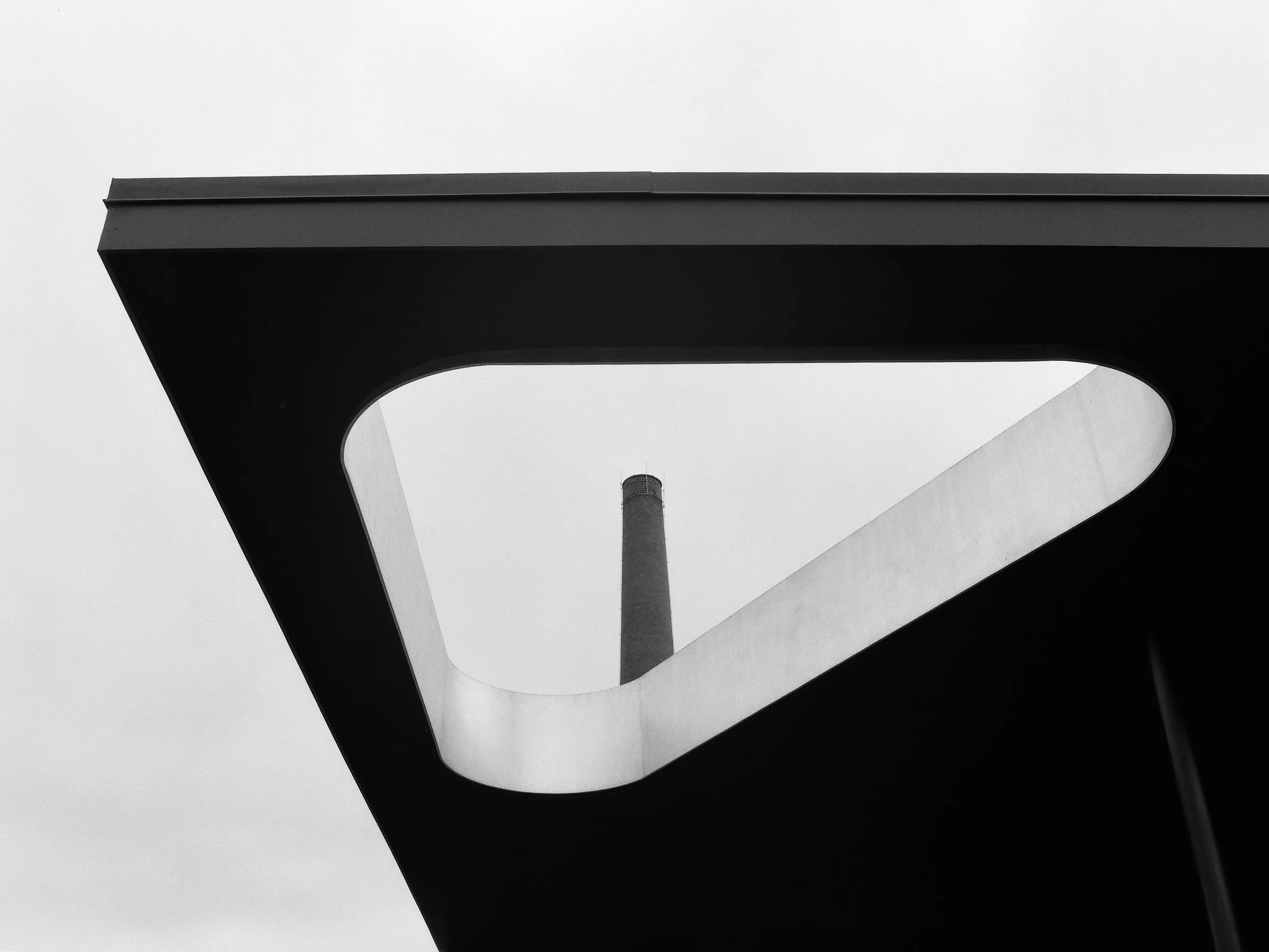 Black canopy cutout framing a smokestack