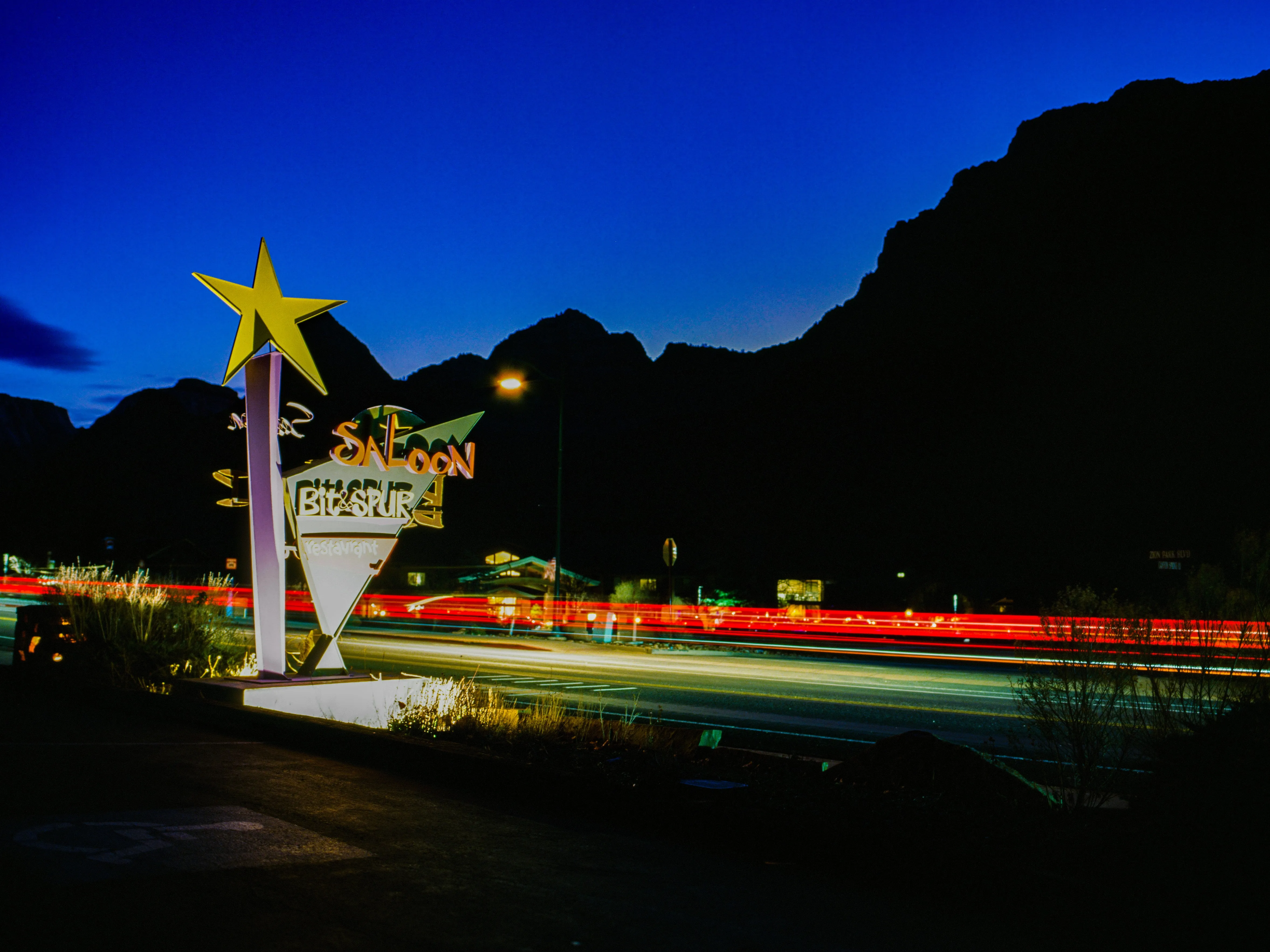 Bit & Spur Saloon sign with light trails, Springdale UT