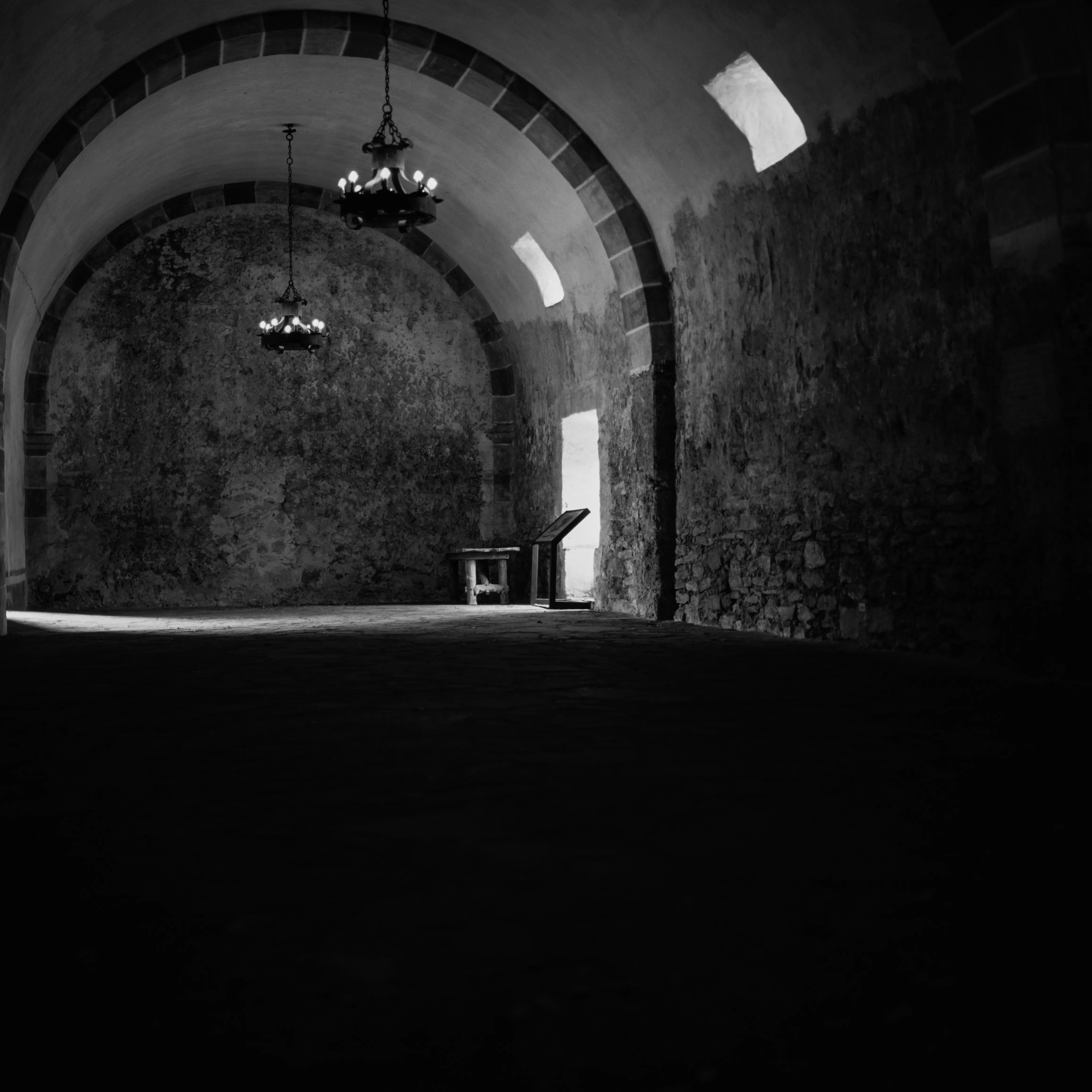 Vaulted mission interior, chandeliers